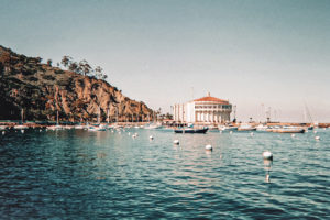 A picture from across Avalon Bay looking out to the Catalina Casino or Catalina Theater in the distance